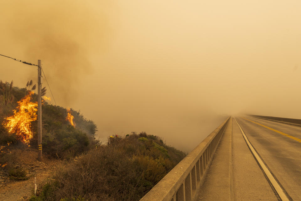 Firefighters with Vandenberg Air Force Base, light a back burn to help control the Dolan Fire at Limekiln State Park in Big Sur, Calif,. Friday, Sept. 11, 2020. (AP Photo/Nic Coury)