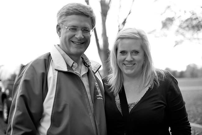 Prime Minister Stephen Harper with photographer Laura Kelly. Laura: "I'm Laura, I'm the photographer!" Stephen Harper: "Oh! Well you haven't had a photo then, have you? Let's see if someone can work your camera." (Photo courtesy of Laura Kelly)