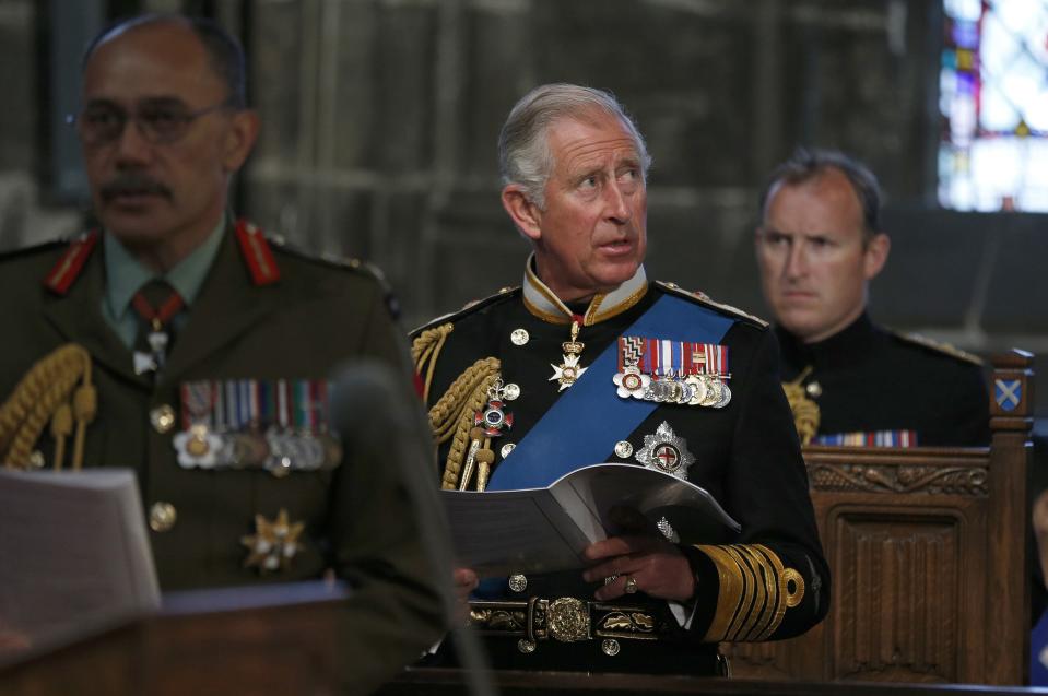 Britain's Prince Charles (C) attends a service for the Commonwealth to commemorate the 100th anniversary of the outbreak of World War One (WW1), in Glasgow Cathedral, in Glasgow, Scotland August 4, 2014. (REUTERS/Russell Cheyne)