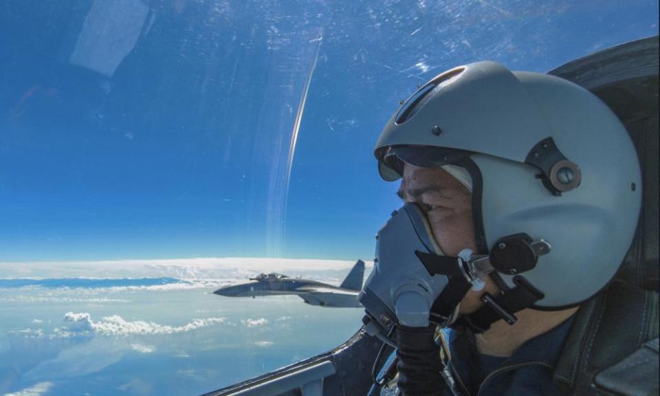 In this photo released by Xinhua News Agency, an air force pilot from the Eastern Theater Command of the Chinese People’s Liberation Army (PLA) looks as they conduct a joint combat training exercises around the Taiwan Island on Sunday, Aug. 7, 2022. China said Monday it was extending threatening military exercises surrounding Taiwan that have disrupted shipping and air traffic and substantially raised concerns about the potential for conflict in a region crucial to global trade. (Wang Xinchao/Xinhua via AP)