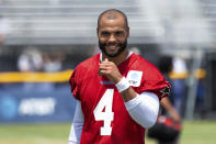 Dallas Cowboys quarterback Dak Prescott smiles following practice at the NFL football team's training camp in Oxnard, Calif., Thursday, July 22, 2021. (AP Photo/Michael Owen Baker)