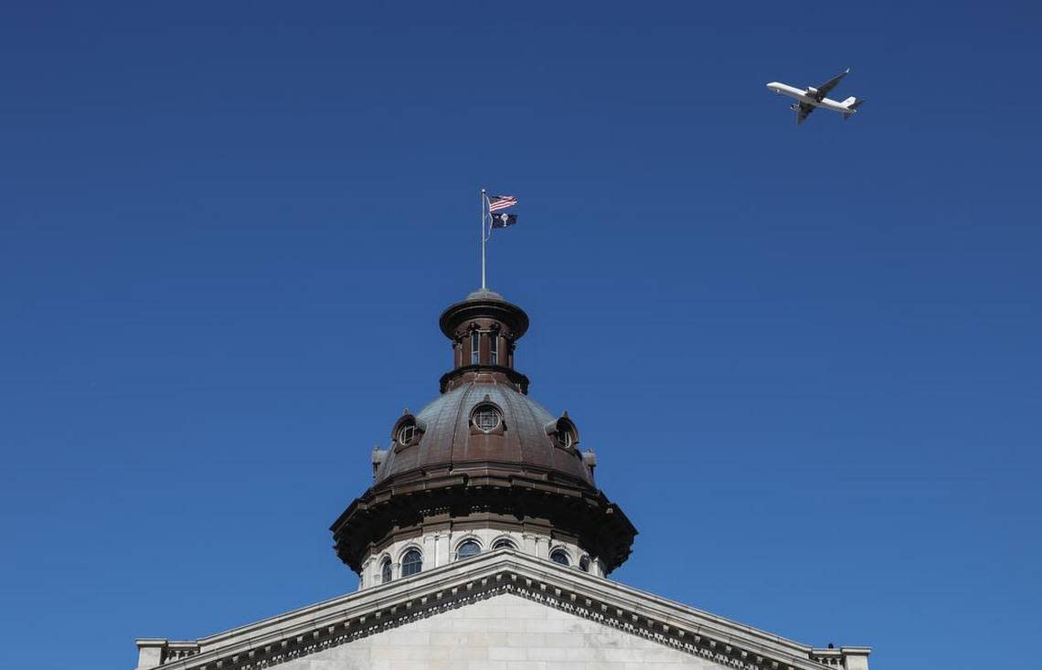 An airplane flies over the South Carolina State House during the inauguration ceremony for Henry McMaster. 1/9/19