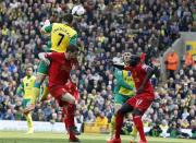 Norwich City's Robert Snodgrass (L) heads to score a goal against Liverpool during their English Premier League soccer match at Carrow Road in Norwich, April 20, 2014. REUTERS/Stefan Wermuth