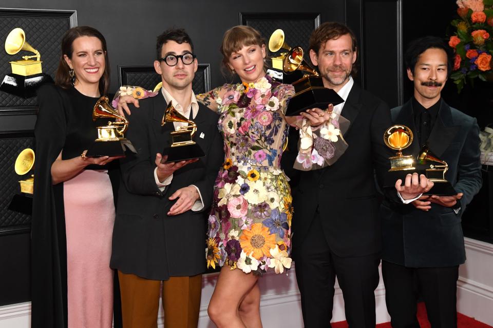 Laura Sisk, Jack Antonoff, Taylor Swift, Aaron Dessner, and Jonathan Low, winners of the Album of the Year award in 2021 for ‘Folklore,’ pose in the media room during the 63rd annual GRAMMY Awards in Los Angeles.