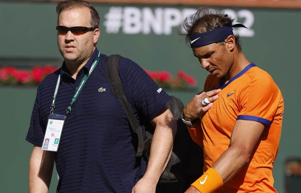 Rafael Nadal, pictured here battling a chest injury in the Indian Wells final against Taylor Fritz.