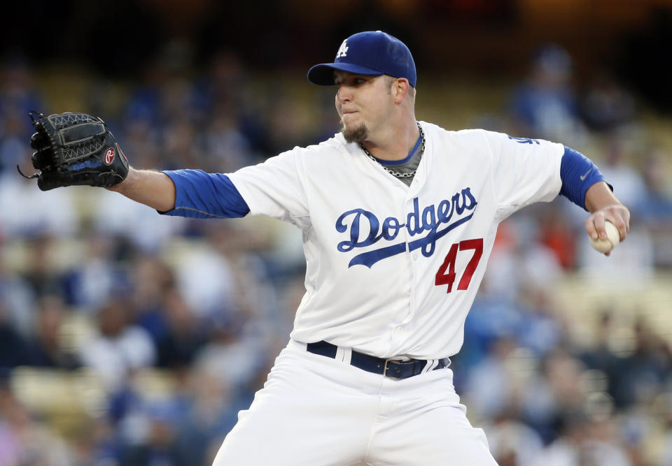 Los Angeles Dodgers starting pitcher Paul Maholm delivers against the San Francisco Giants during the first inning of a baseball game , Friday, May 9, 2014, in Los Angeles. (AP Photo/Danny Moloshok)