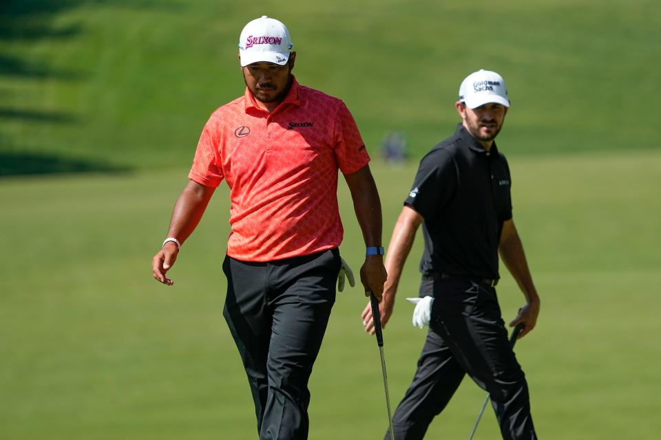 June 2, 2023;  Dublin, Ohio, USA;  Hideki Matsuyama and Patrick Cantlay walk around the second green during the second round of the Memorial Tournament at Muirfield Village Golf Club. 