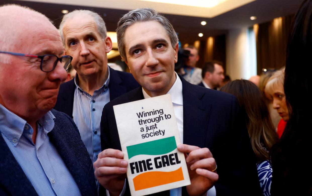 Simon Harris poses after being announced as the new leader of Fine Gael at the party's leadership election convention, in Athlone, Ireland, on Sunday