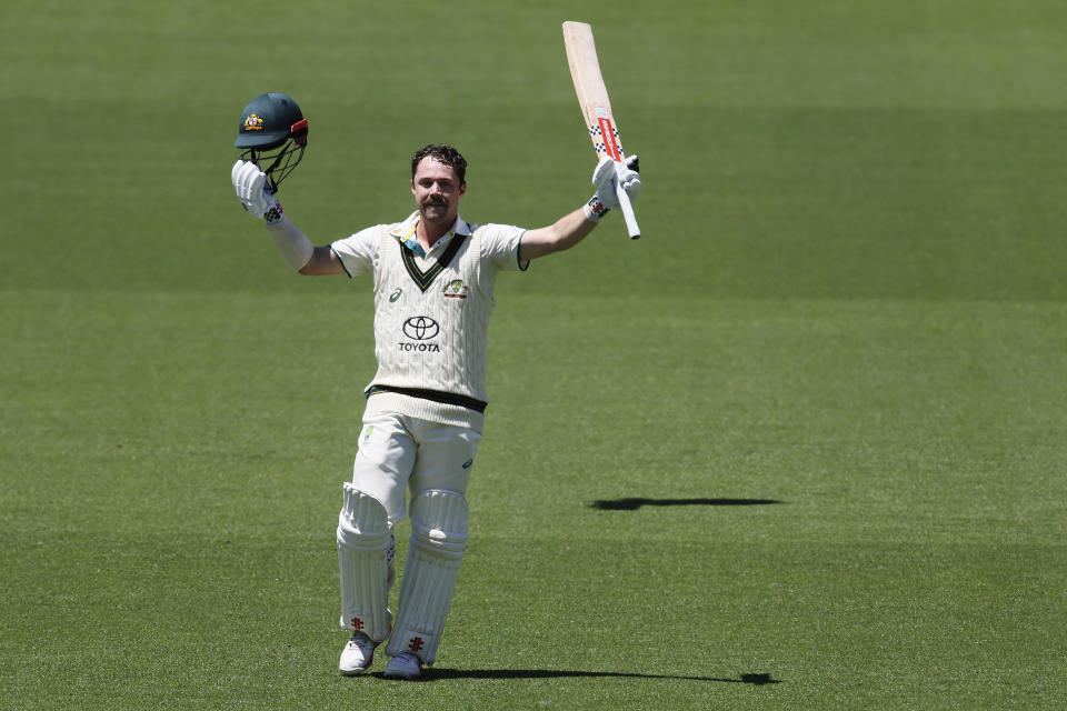 Australia's Travis Head celebrates making 100 runs abasing the West Indies on the second day of their cricket test match in Adelaide, Australia, Thursday, Jan. 18, 2024. (AP Photo/James Elsby)