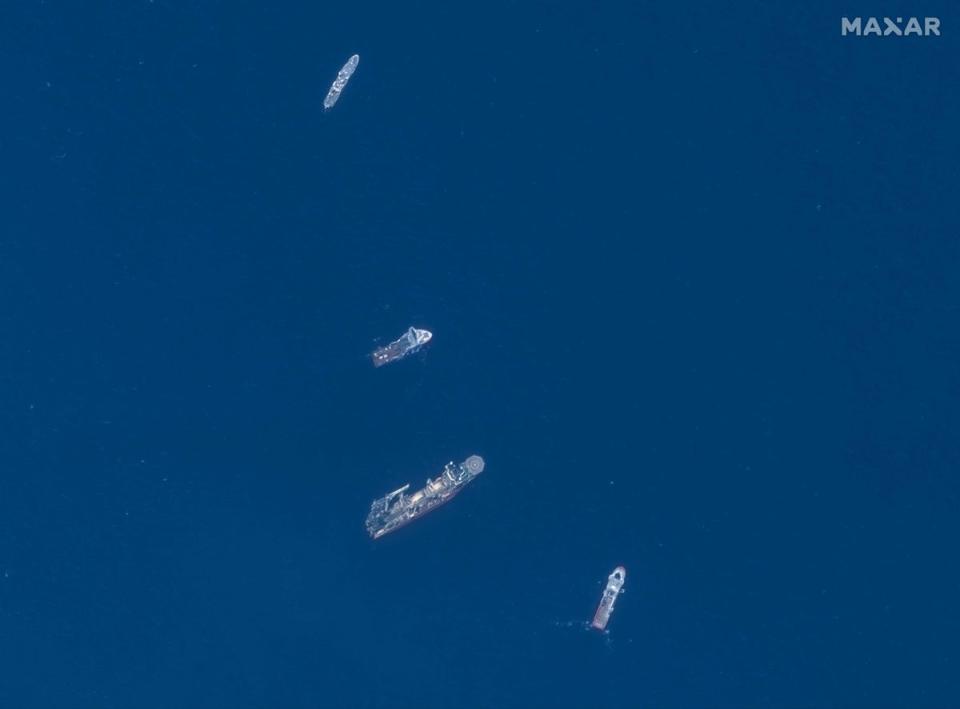 This June 22, 2023, satellite image courtesy of Maxar Technologies shows the Horizon Arctic (2nd from top), Deep Energy (C) and Skandi Vinland (bottom) searching on Thursday for the missing Titan submersible (Maxar Tech/AFP/Getty)