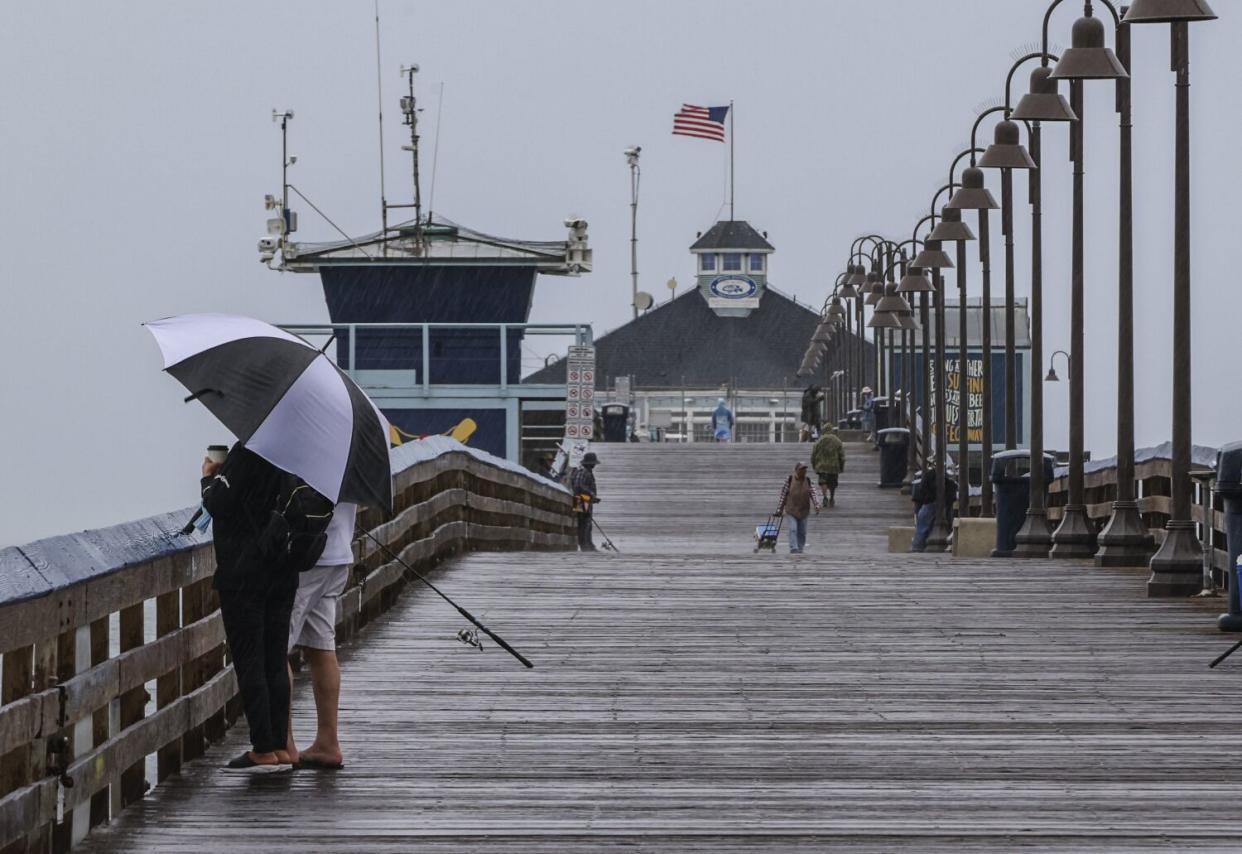 People enjoy the stormy weather during the morning hours