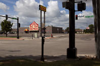 The intersection of 25th Street South and 9th Avenue South are seen on Saturday, July 15, 2023, in Fargo, N.D., where one police officer was fatally shot and two others were wounded a day earlier. Authorities said the suspect was also killed in the shooting, and a civilian was injured. (AP Photo/Ann Arbor Miller)