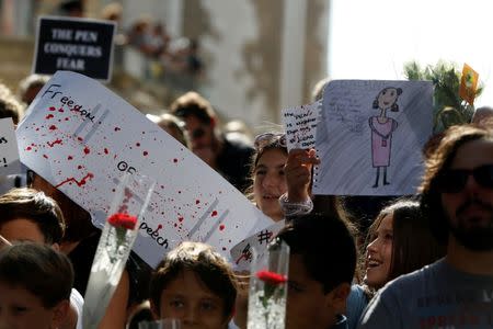 Children join a protest against the assassination of investigative journalist Daphne Caruana Galizia last Monday, in Valletta, Malta, October 22, 2017. REUTERS/Darrin Zammit Lupi