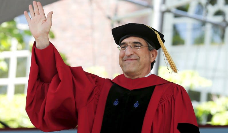 Yale University president Peter Salovey acknowledges the crowd as he receives an honorary Doctor of Laws degree during commencement at Harvard University in Cambridge, Mass., May 28, 2015.