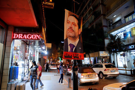 FILE PHOTO: A poster depicting Former Prime Minister Saad al-Hariri is seen in Beirut, Lebanon, November 14, 2017. REUTERS/Jamal Saidi/File Photo