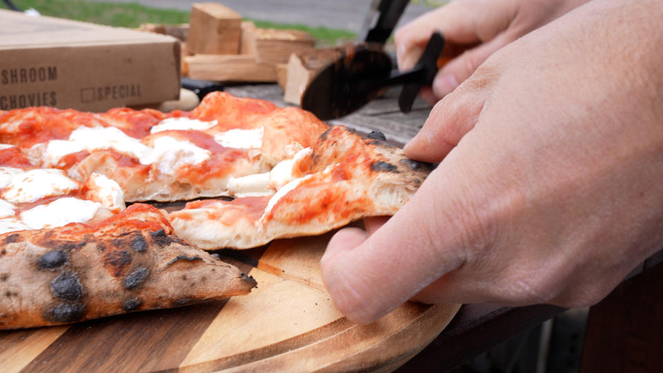 slicing a pizza