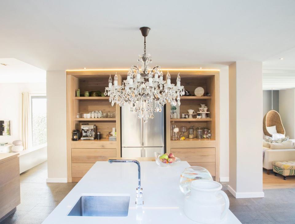 a kitchen with a chandelier
