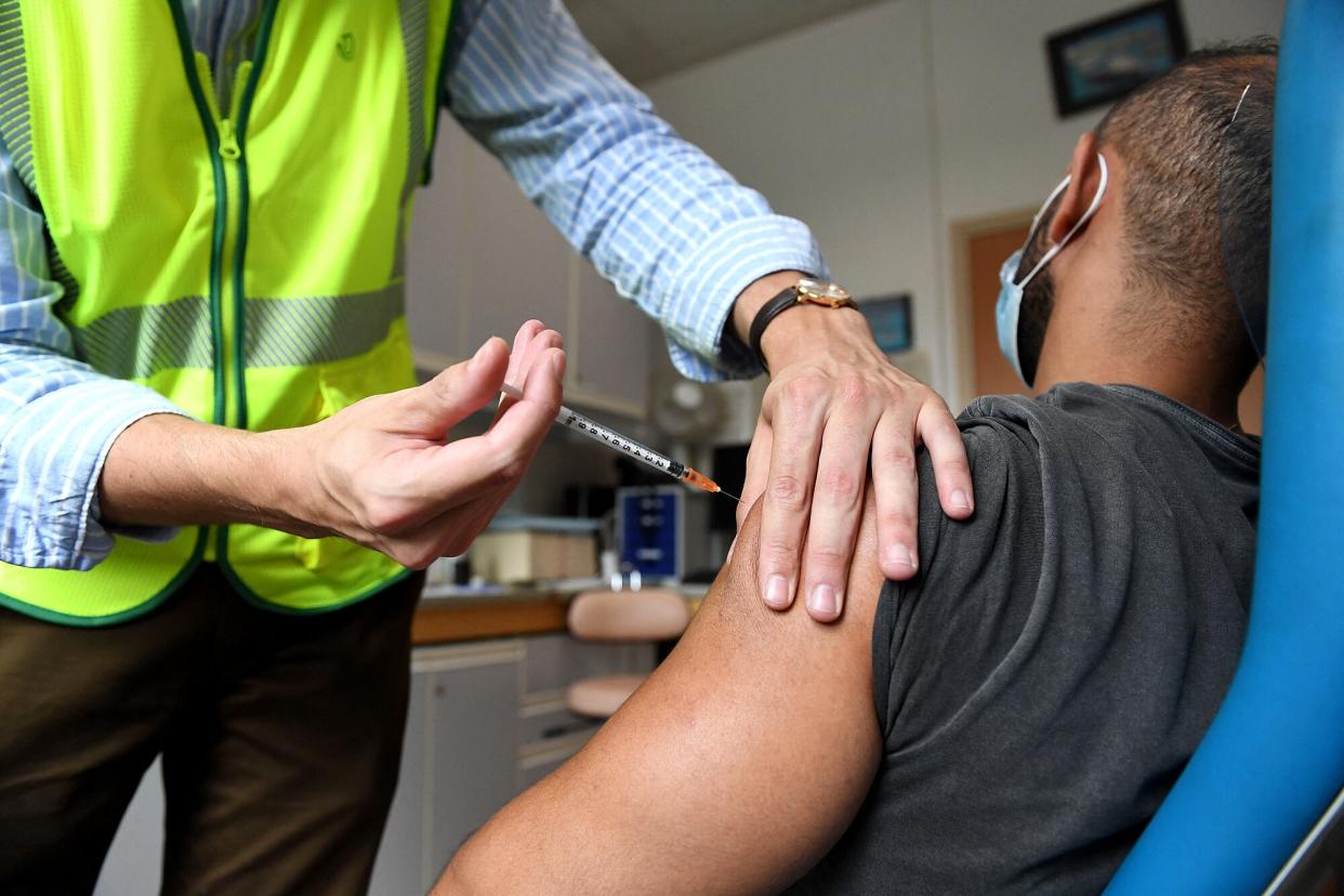 A man receives a dose of the Monkeypox vaccine