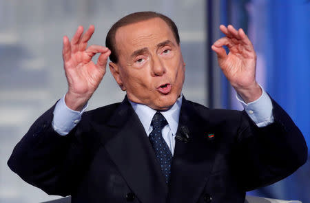 FILE PHOTO : Italy's former Prime Minister Silvio Berlusconi gestures during the television talk show "Porta a Porta" (Door to Door) in Rome, Italy June 21, 2017. REUTERS/Remo Casilli/File Photo