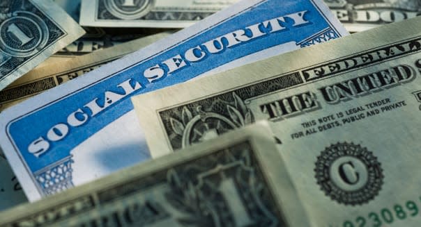 Studio shot of social security card and banknotes