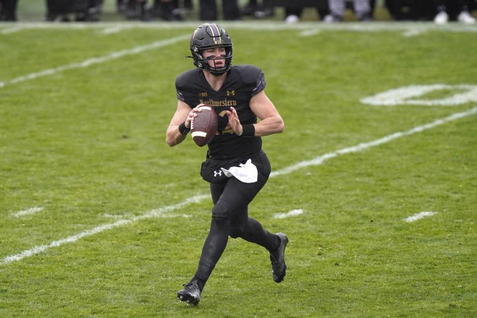 Former Northwestern quarterback Peyton Ramsey looks to a throw pass during the first half of an NCAA college basketball game against Illinois in Evanston, Ill., Saturday, Dec. 12, 2020. (AP Photo/Nam Y. Huh)