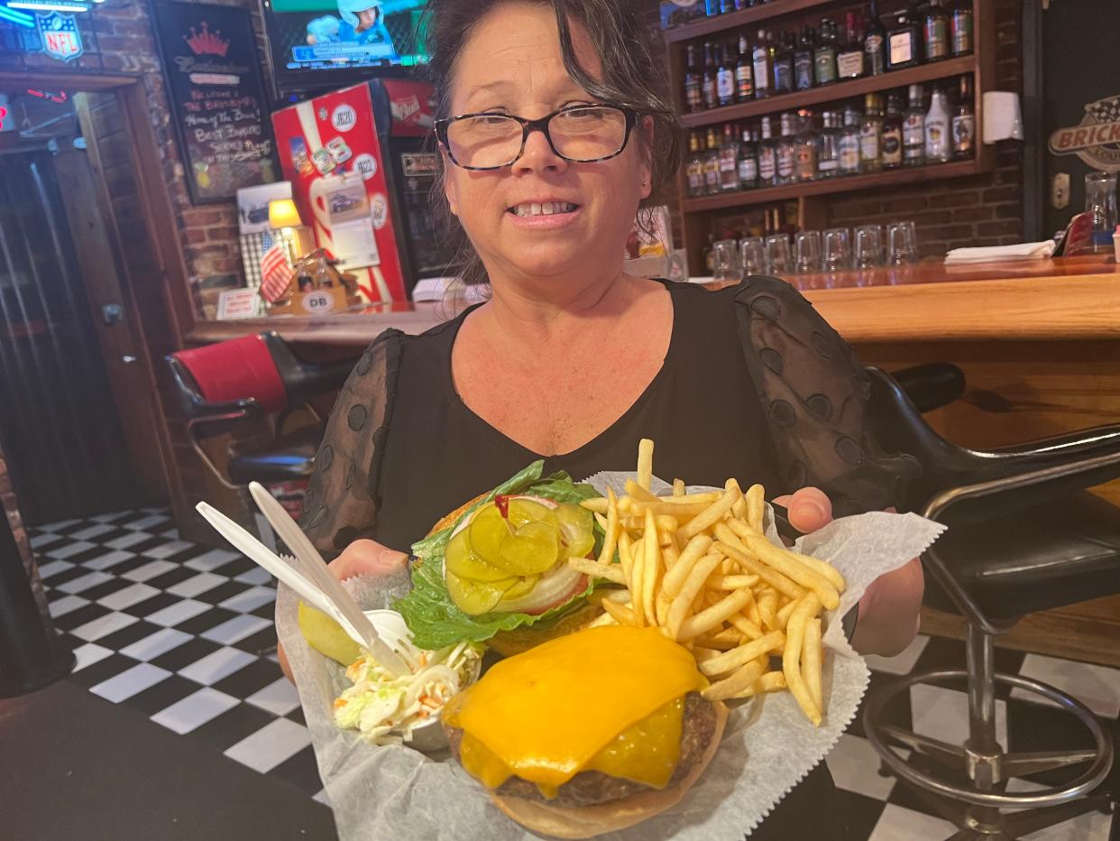 Donna Gross, pictured on Thursday, Aug. 24, 2023, has been a server/bartender at the Brickyard Lounge & Grill at 747 W. International Speedway Blvd. in Daytona Beach the past seven years. "I love working here," she said. "It's the best job I've had in this town."