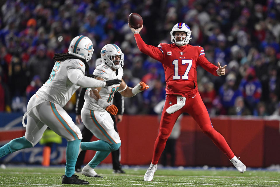 Buffalo Bills quarterback Josh Allen (17) looks to pass during the second half of an NFL football game against the Miami Dolphins in Orchard Park, N.Y., Saturday, Dec. 17, 2022. (AP Photo/Adrian Kraus)