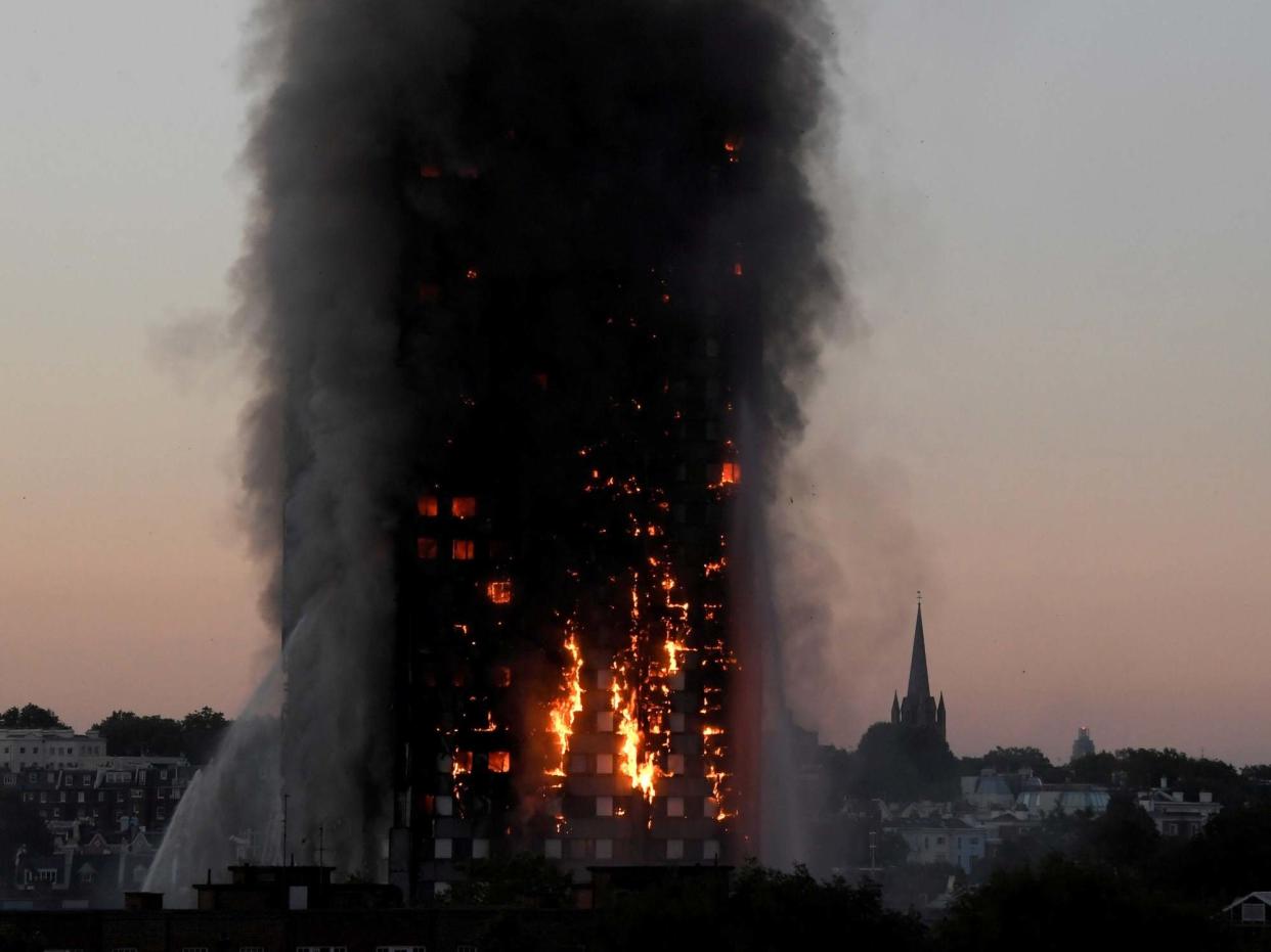 Flames and smoke billow as firefighters deal with a serious fire in the Grenfell Tower apartment block: Reuters