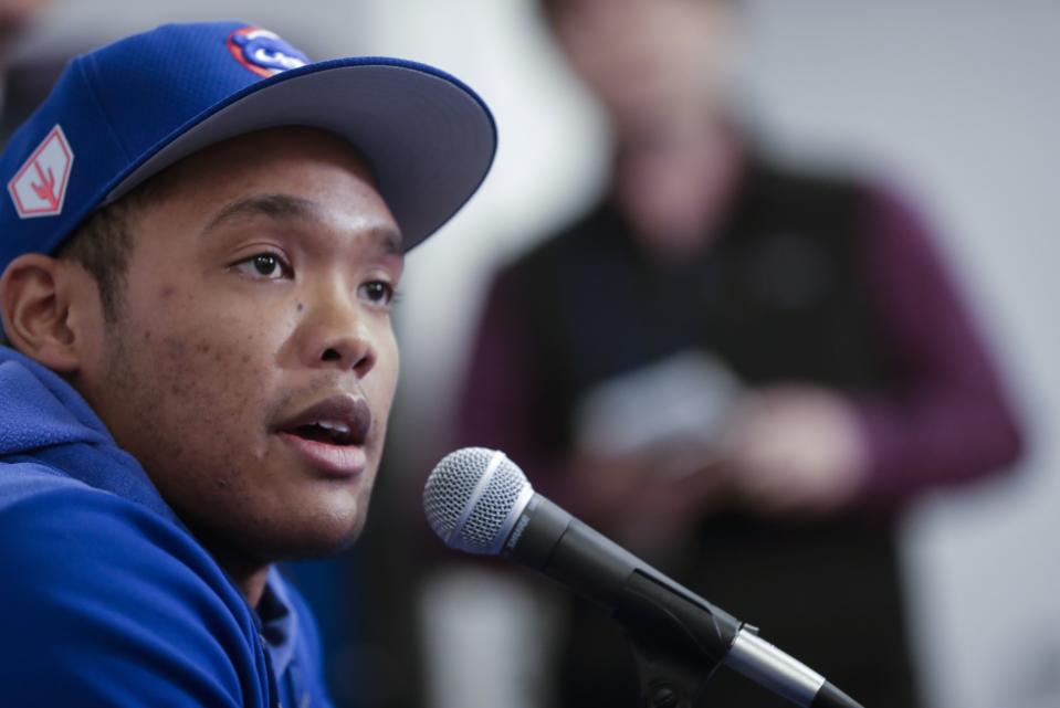 Chicago Cubs shortstop Addison Russell speaks at a press conference after a spring training baseball workout Friday, Feb. 15, 2019, in Mesa, Ariz. (AP Photo/Morry Gash)