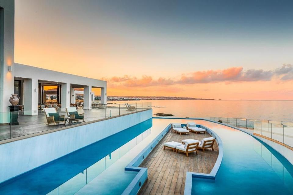 <p>For the epitome of luxury Greek living, look no further than <a href="https://www.booking.com/hotel/gr/abaton-island-resort-amp-spa.en-gb.html?aid=1922306&label=best-hotels-greece" rel="nofollow noopener" target="_blank" data-ylk="slk:Abaton Island Resort and Spa;elm:context_link;itc:0;sec:content-canvas" class="link ">Abaton Island Resort and Spa</a> in Hersonissos. It's tempting to hunker down for the week and enjoy the brace of sea-facing infinity pools with wet beds and day beds, a swish Elemis spa with a heated indoor pool. There's also a private beach to play on.</p><p>A rash of low-rise, white-washed buildings house the 152 beautifully serene rooms, and almost half have their own heated saltwater pools. There are five restaurants to dine in, including Elemes, famous for its Cretan specialities like zucchini blossoms stuffed with feta and mint, and strapatsada, eggs with Cretan sausage and sour mizithra. Meanwhile, the rustic-chic Bony Fish is a popular beachfront seafood restaurant.</p><p><a class="link " href="https://www.booking.com/hotel/gr/abaton-island-resort-amp-spa.en-gb.html?aid=1922306&label=best-hotels-greece" rel="nofollow noopener" target="_blank" data-ylk="slk:CHECK AVAILABILITY;elm:context_link;itc:0;sec:content-canvas">CHECK AVAILABILITY</a></p>