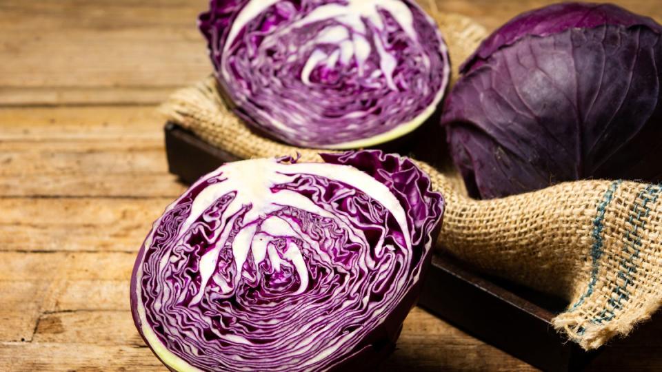 Purple cabbage on a rustic wooden table