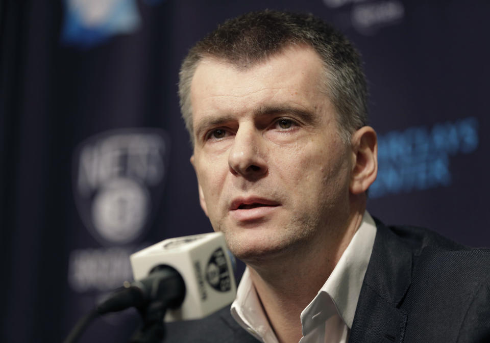 FILE - Brooklyn Nets owner Mikhail Prokhorov speaks during a news conference in New York, Monday, Jan. 11, 2016. When President Vladimir Putin came to power in 2000, the outside world viewed Russia's "oligarchs" as men who whose vast wealth made them almost shadow rulers. Putin was reported to have told about two dozen of the men regarded as the top oligarchs in a meeting later in 2000 that if they stayed out of politics, their wealth wouldn't be touched. Putin tolerated the 2012 presidential run against him by Prokhorov, who made a fortune in metals, but the bid was widely seen as a Kremlin-supported ploy aimed at creating the impression of genuine political pluralism in Russia. (AP Photo/Seth Wenig, File)
