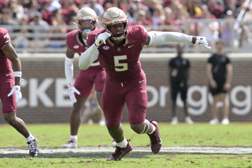 Florida State defensive lineman Jared Verse (5) follows a play against Syracuse.