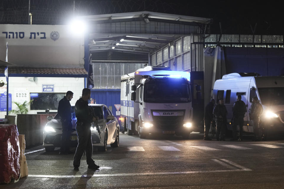 An Israeli prison transport vehicle carries Palestinian prisoners released by the Israeli authorities from Ofer military prison near Jerusalem on Friday, Nov. 24, 2023. The release came on the first day of a four-day cease-fire deal between Israel and Hamas during which the Gaza militants have pledged to release 50 hostages in exchange for 150 Palestinians imprisoned by Israel. (AP Photo/Mahmoud Illean)