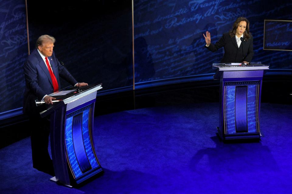 Democratic presidential nominee, U.S. Vice President Kamala Harris speaks during a presidential debate hosted by ABC as Republican presidential nominee, former U.S. President Donald Trump listens, in Philadelphia, Pennsylvania, U.S., September 10, 2024.