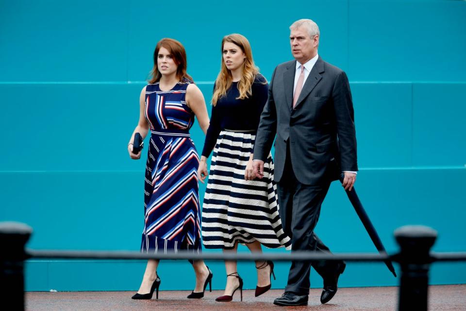 Princess Eugenie of York, Princess Beatrice of York and Prince Andrew, Duke of York walk about during 