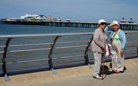 Women stand in the sun on the promenade in Blackpool, northern England, Britain July 21, 2016. REUTERS/Phil Noble