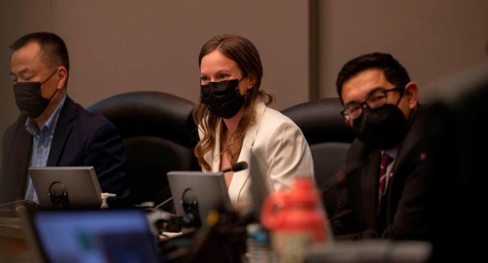 Caity Maple sits at the dais on her first day as a Sacramento City Council member after being sworn in along with other newly elected members Tuesday, Dec. 13, 2022.