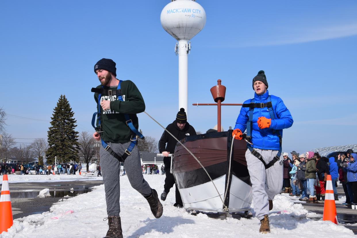 "The Runs" crosses the finish line after their second run at the March 4, 2023 Outhouse Races. The team ended as the overall winners with a combined time of 73.96 seconds across three races.