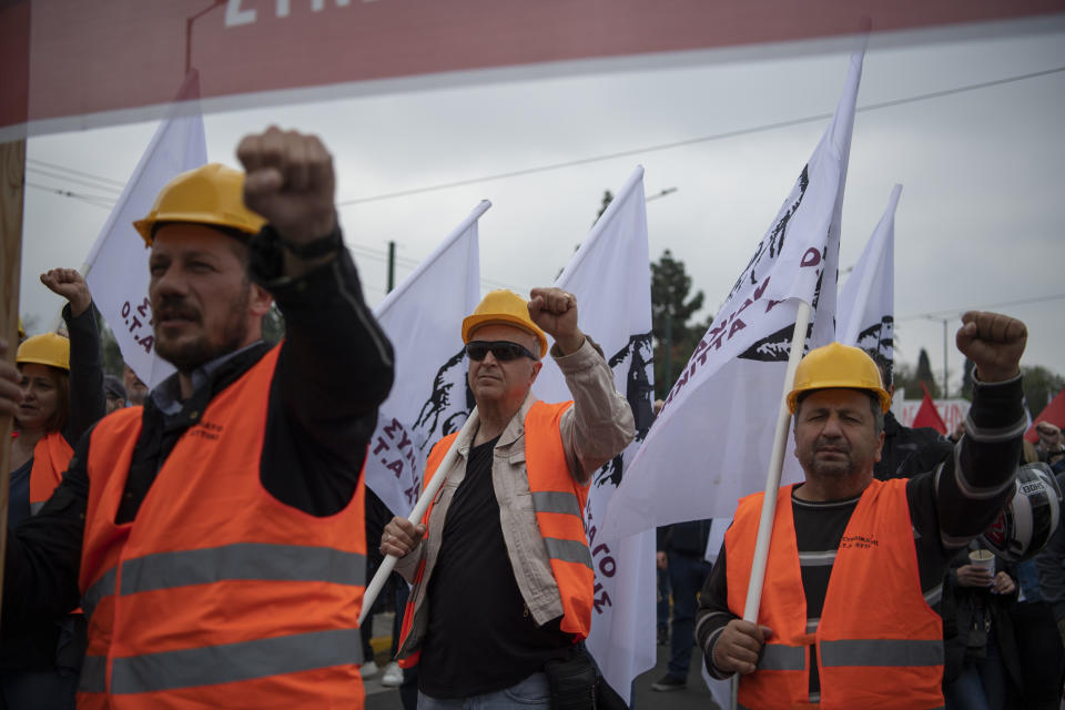 Protesters raise their fists during a May Day rally in Athens, Greece, Monday, May 1, 2023. May Day protests took place in the Greek capital 20 days before the parliamentry elections 2023. (AP Photo/Michael Varaklas)