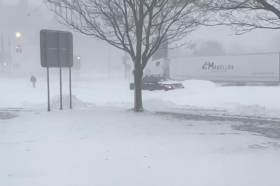 High winds and snow covers the streets and vehicles in Buffalo, N.Y. on Sunday, Dec. 25, 2022.