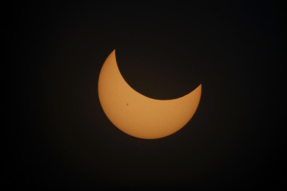 An annular solar eclipse seen from Tatacoa Desert, Colombia, Saturday, Oct. 14, 2023. The annular eclipse dimmed the skies over parts of the western U.S. and Central and South America. (AP Photo/Ivan Valencia)