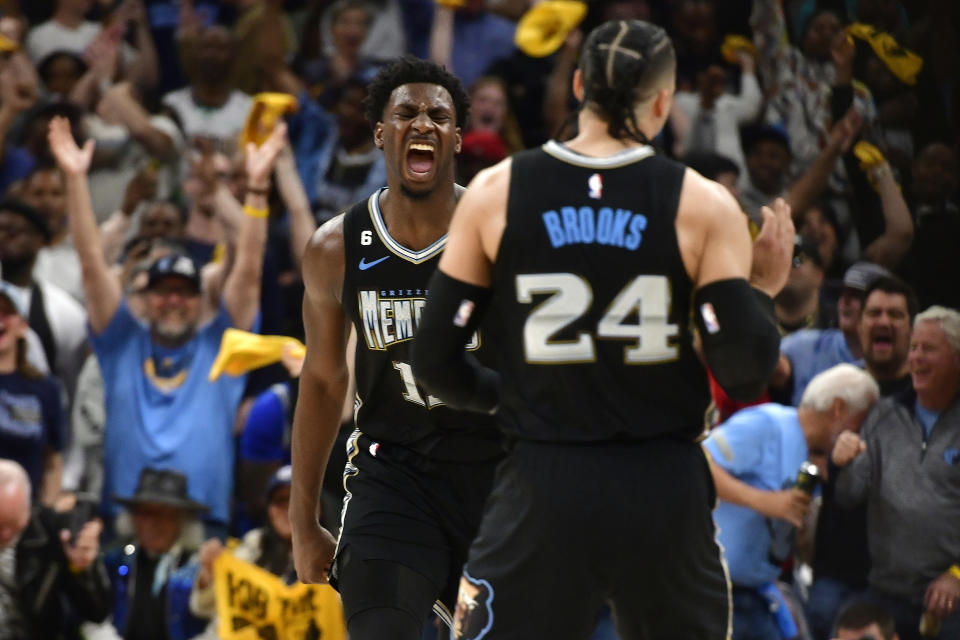 Memphis Grizzlies forwards Jaren Jackson Jr. and Dillon Brooks (24) react during the second half of Game 2 in a first-round NBA basketball playoff series against the Los Angeles Lakers Wednesday, April 19, 2023, in Memphis, Tenn. (AP Photo/Brandon Dill)