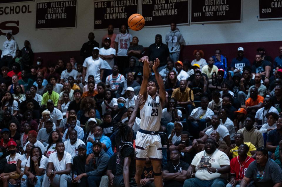 Dwyer Blake Wilson (23) attempts to make a three-pointer while being guarded by Lake Worth guard Joseph Rogers (3) during the first half of the game between Dwyer and host Lake Worth on Tuesday, January 31, 2023, in Lake Worth Beach, FL. Final score, Lake Worth, 62, Dwyer, 57.