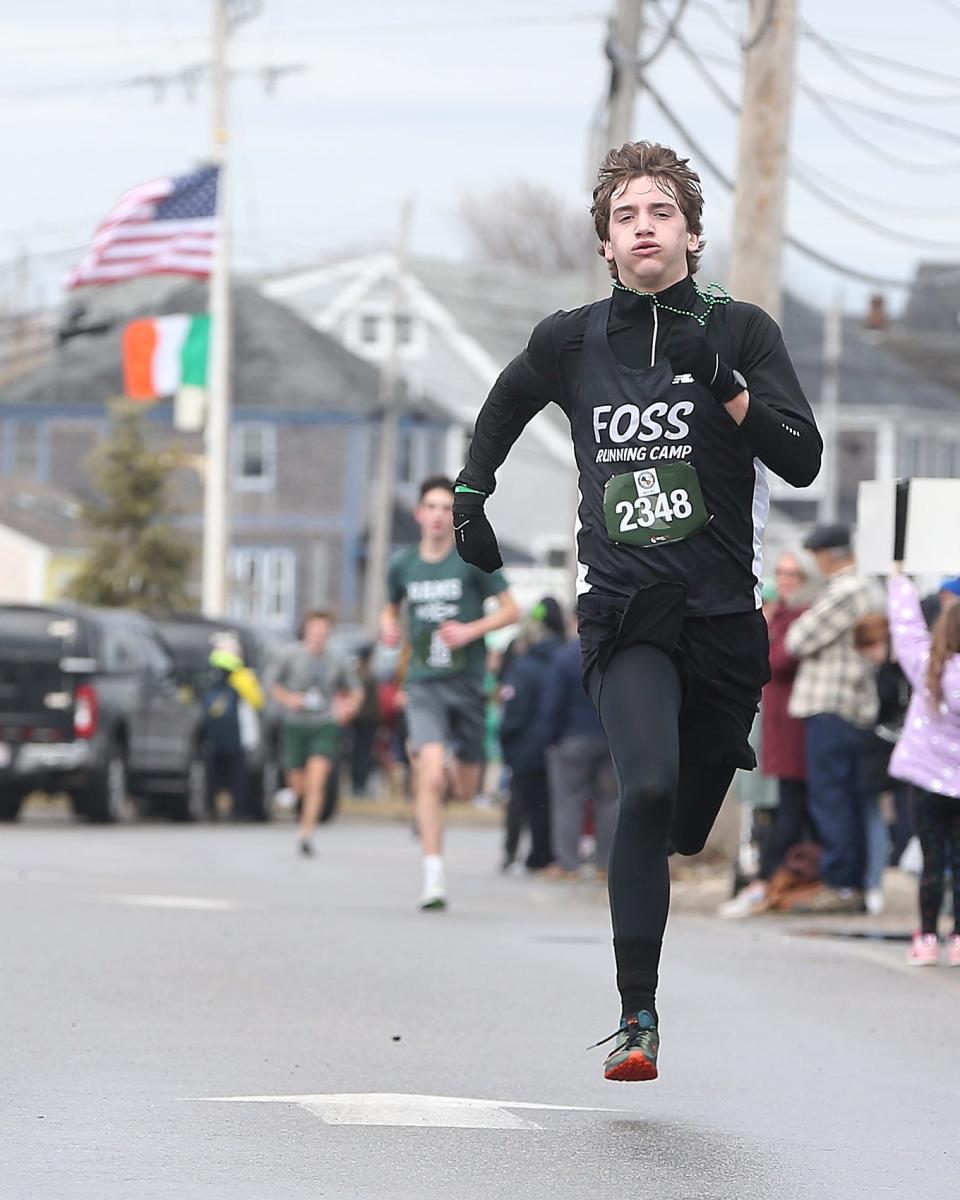 Taite Panton spins to the finish line to finish 15th overall during the 13th annual St. Patrick’s Day 5K in Marshfield on Saturday, March 18, 2023. Over 2800 runners and walkers participated in the 5K that was raising money for the Marshfield Education Foundation.
