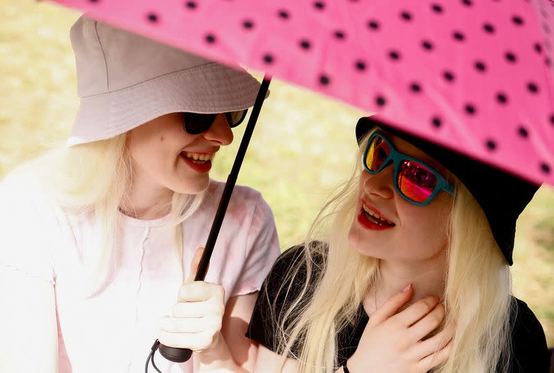 Teenage sisters with albinism must take extra care in Rome heatwave