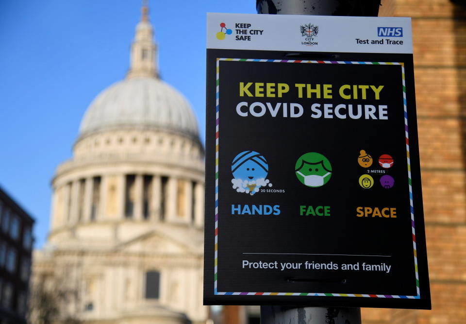 A public health information sign at St Paul's Cathedral, London. Photo: Toby Melville/Reuters