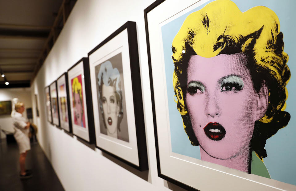 <p>A visitor observes a group of screenprints entitled ‘Kate Moss’ by British Banksy during the exhibition ‘The Art of Banksy’ in Berlin, Germany on June 20, 2017. (Felipe Trueba/EPA/REX/Shutterstock) </p>