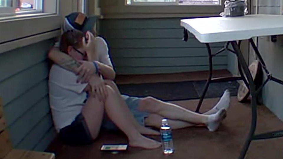 A doorbell camera captures Katie Kolka as she is comforted by her husband after learning that Maddi Kingsbury's remains were found. / Credit: Katie Kolka