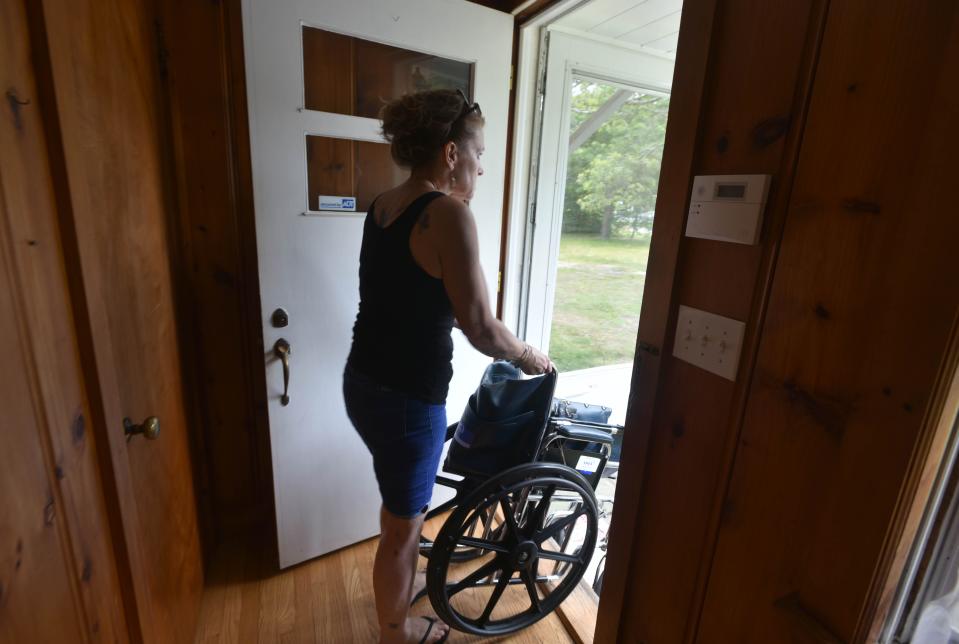 Alessandra Dabliz removes the last item from her home on Dunns Pond Road in Hyannis after being evicted. The eviction followed a court proceeding, according to the landlord's attorney.